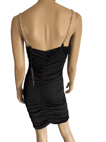 Abito nero con bretelle a catena